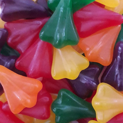 An assortment of colorful airplane shaped gummy lollies in a variety of fruit flavors