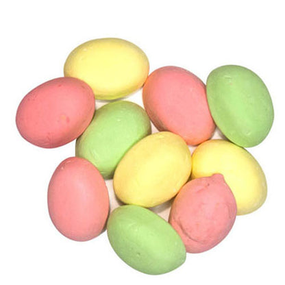 A collection of dome shaped yellow pink and green assorted puff grained marshmallow lollies