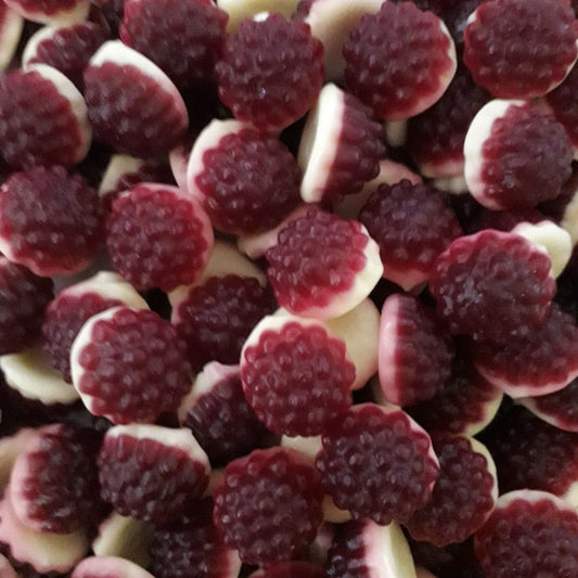 A pile of dual layered red and white dome shaped boysenberries and cream gummy lollies