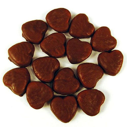 Red strawberry flavored chew heart lollies coated in smooth milk chocolate