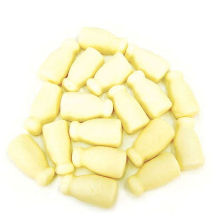 Close up of opaque white bottle shaped aerated gummy milk bottle lollies
