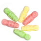 Colorful assortment of eskimo shaped grained marshmallow emo lollies in yellow pink and green