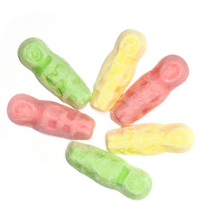 Colorful assortment of eskimo shaped grained marshmallow emo lollies in yellow pink and green