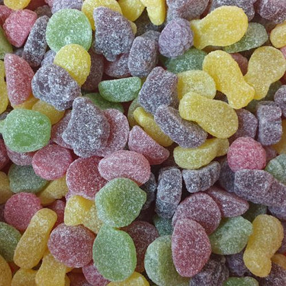 A colorful assortment of sugar coated fruit shaped jelly lollies in multiple flavors