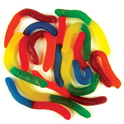 A vibrant pile of multi colored worm shaped gummy lollies in mixed fruit flavors