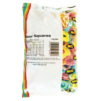 Colorful mix of Rainbow Sour Squares featuring vibrant, square-shaped aerated gummy lollies coated in a fine dusting of sour powder.