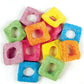 A colorful mix of Rainbow Sour Squares with vibrant, square-shaped aerated gummy lollies coated in a fine dusting of sour powder.