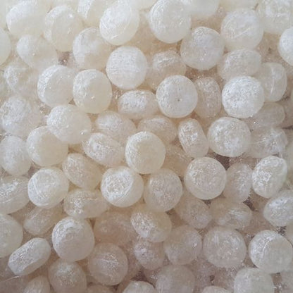 Bulk bag of traditional yellow acid drops hard boiled confectionery lollies